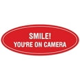 thumbnail image 1 of Signs ByLITA Oval Smile You're on Camera Sign - Laser-Engraved Lettering | Durable ABS Plastic | Vibrant Colors | Powerful Foam Tape (Red) - Large, 1 of 3