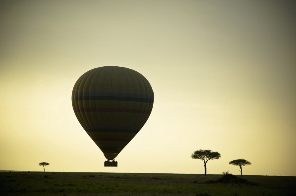 Silhouette Of A Hot Air Balloon Just Off The Ground At Dusk Masai Mara Kenya Canvas Art - David DuChemin Design Pics (19 x 12)