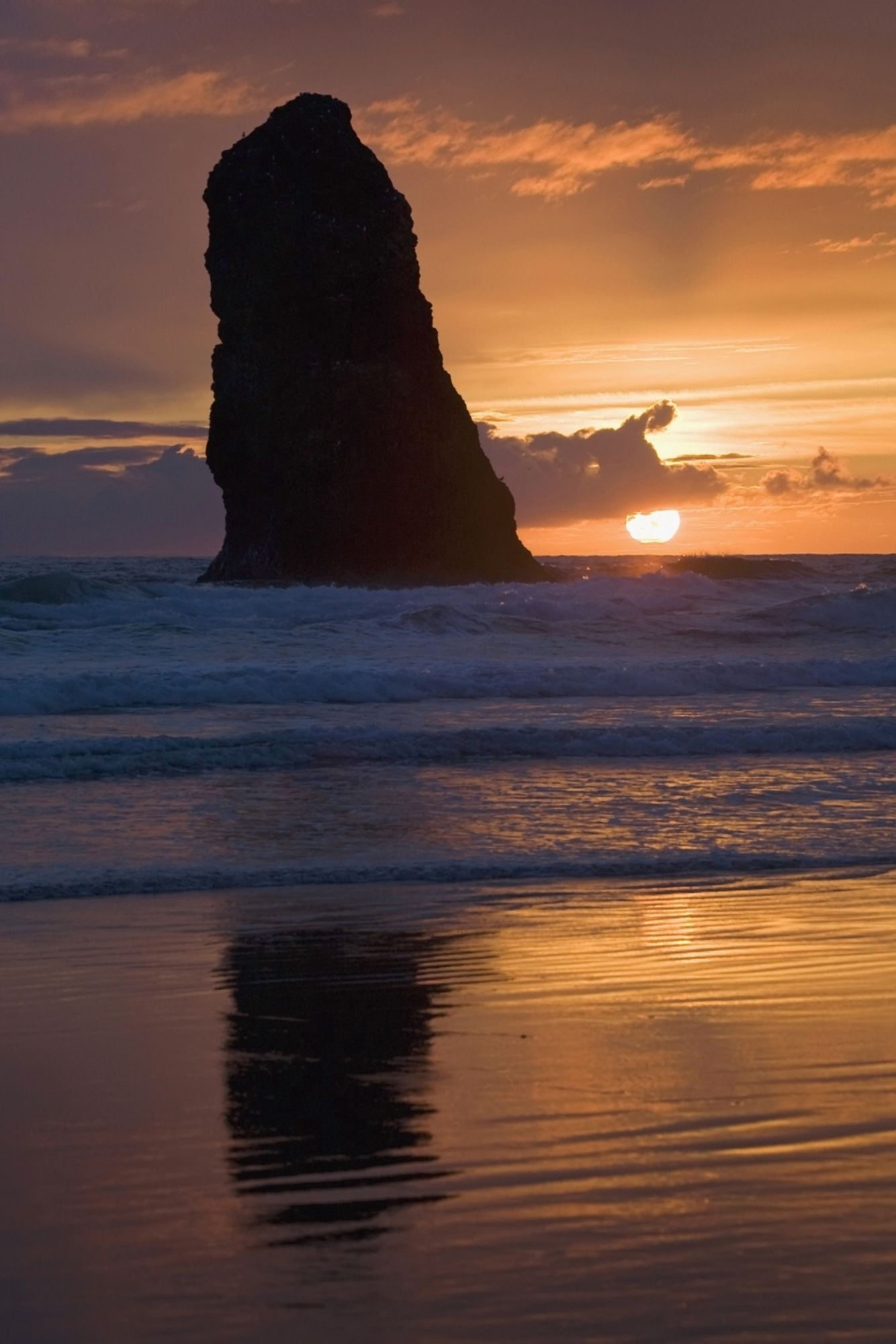 Silhouette Of A Rock Formation At Sunset Cannon Beach Oregon United States of America Canvas Art - Michael Interisano Design Pics (24 x 38)