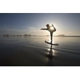thumbnail image 1 of Silhouette Of Female Surfer Doing Bow Pulling Yoga Pose; Chesterman Beach Tofino Vancouver Island British Columbia Canad, 1 of 4