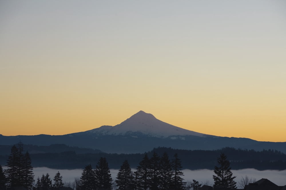 Silhouette Of Mountain Peak At Sunrise Canvas Art - Craig Tuttle Design Pics (19 x 12)