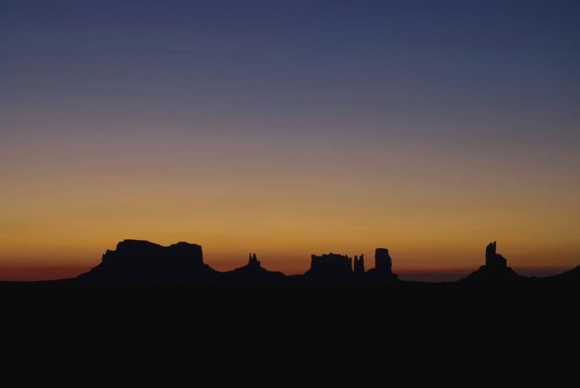 Silhouette Of Rock Formations At Sunset Canvas Art - Philippe Widling Design Pics (19 x 12)