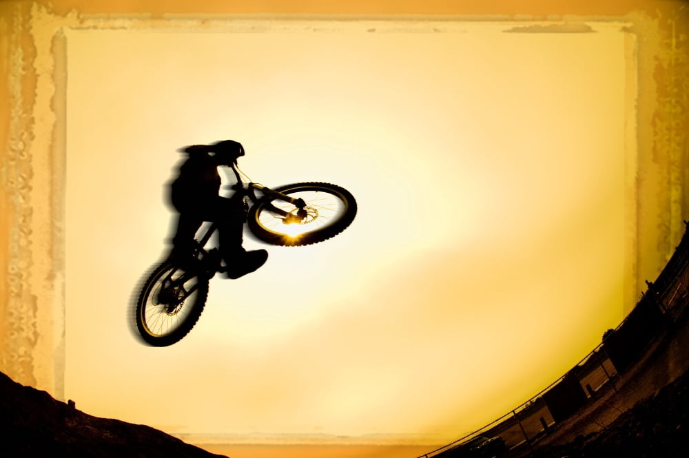 Silhouette Of Stunt Cyclist Canvas Art - Corey Hochachka Design Pics (17 x 11)