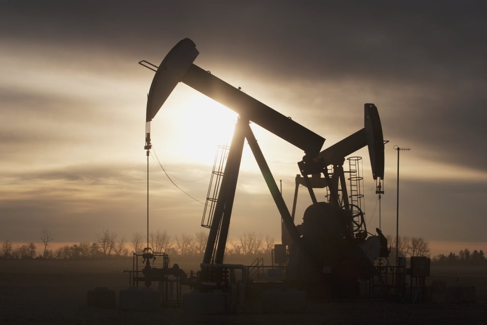 Silhouette Of Two Pump Jacks At Sunrise With Clouds Alberta Canada Canvas Art - Michael Interisano Design Pics (19 x 12)