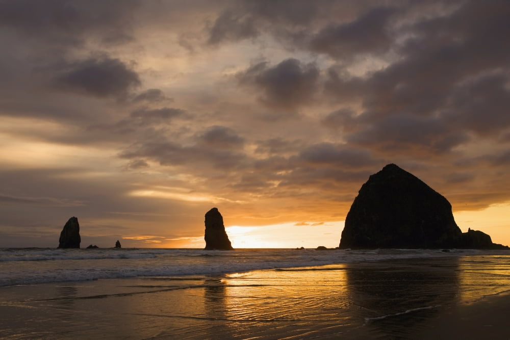 Silhouette Of Rock Formations And Haystack Rock At Sunset Cannon Beach Oregon United States of America Canvas Art - Michael Interisano Design Pics (18 x 12)