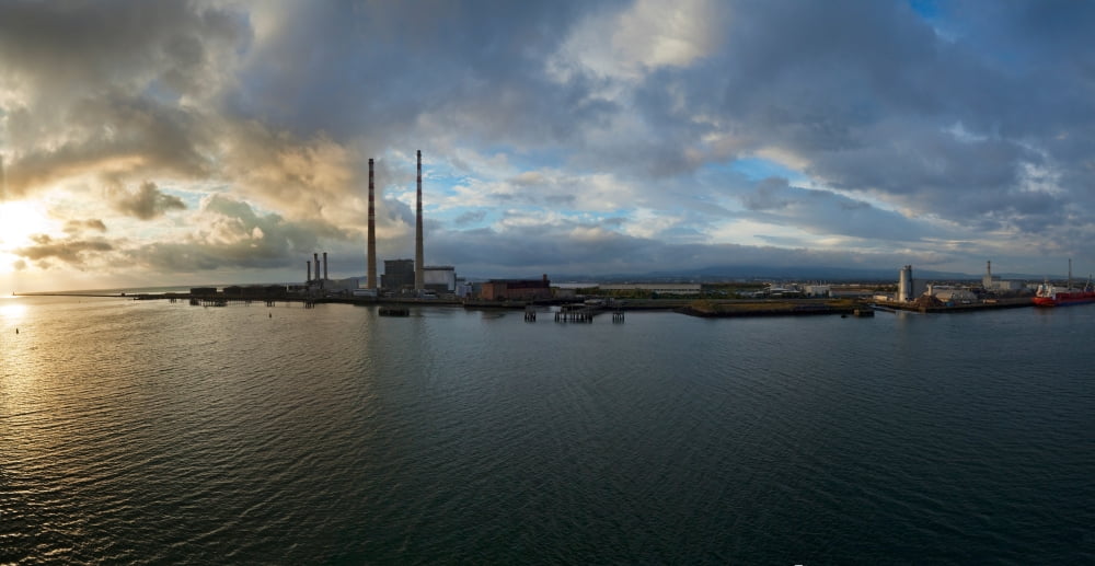 Silhouette of chimneys of the Poolbeg Generating Station at dawn River Liffey Dublin Bay Dublin Republic Of Ireland Canvas Art - Panoramic Images (27 x 9)