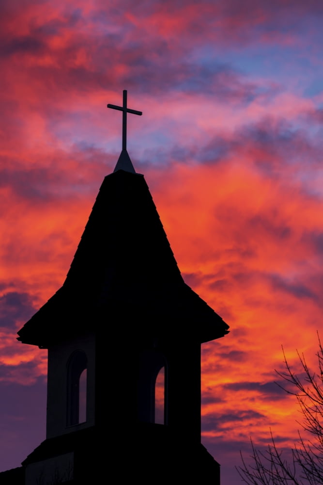 Silhouette of a church steeple with colourful clouds and blue sky in the background Calgary Alberta Canada Canvas Art - Michael Interisano Design Pics (12 x 19)