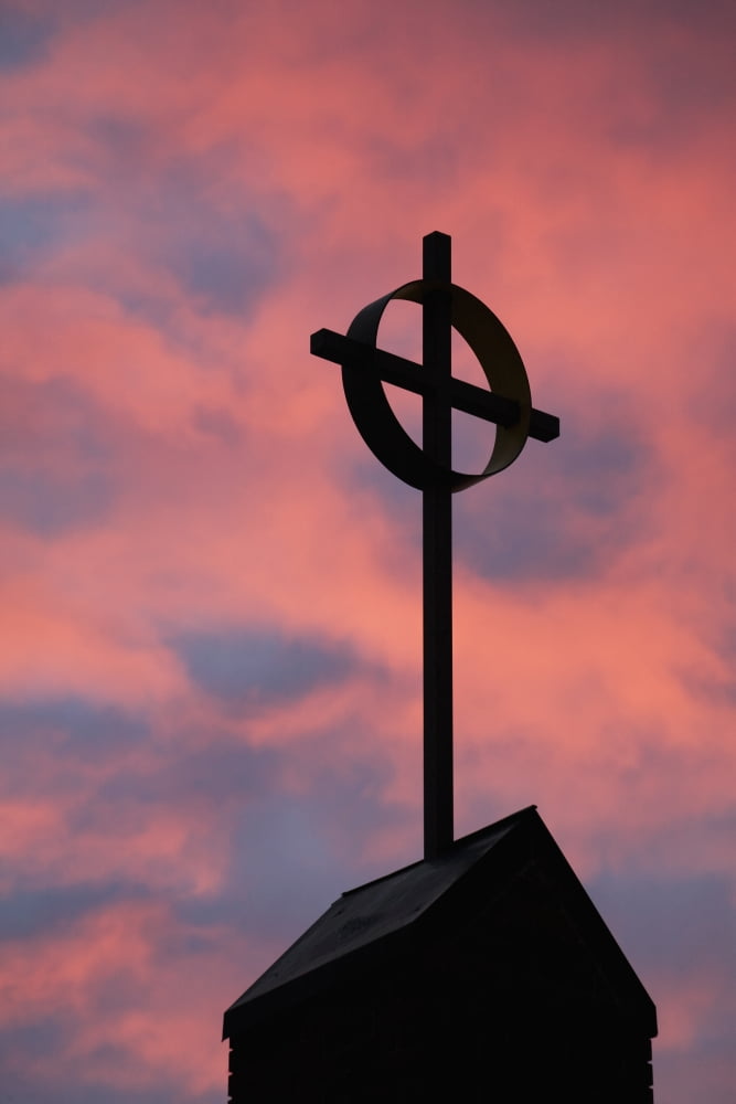 Silhouette of a cross on church steeple with fiery cloud cover in the sky at sunriseCalgary alberta canada Canvas Art - Michael Interisano Design Pics (24 x 38)