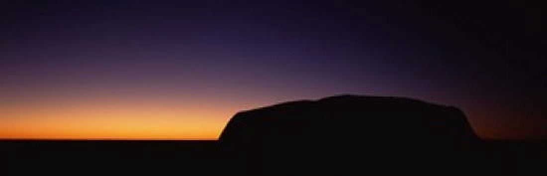 Silhouette of Ayers Rock formations on a landscape Uluru-Kata Tjuta National Park Northern Territory Australia Canvas Art - Panoramic Images (18 x 6)