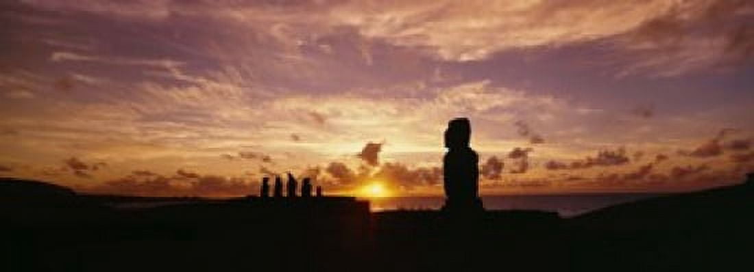 Silhouette of Moai statues at dusk Tahai Archaeological Site Rano Raraku Easter Island Chile Canvas Art - Panoramic Images (18 x 7)