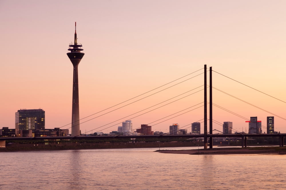 Silhouette of Rheinturm Tower and Rheinkniebrucke Bridge Dusseldorf North Rhine Westphalia Germany Canvas Art - Panoramic Images (27 x 9)