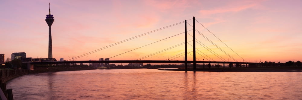 Silhouette of Rheinturm Tower and Rheinkniebrucke Bridge Dusseldorf North Rhine Westphalia Germany Canvas Art - Panoramic Images (36 x 12)
