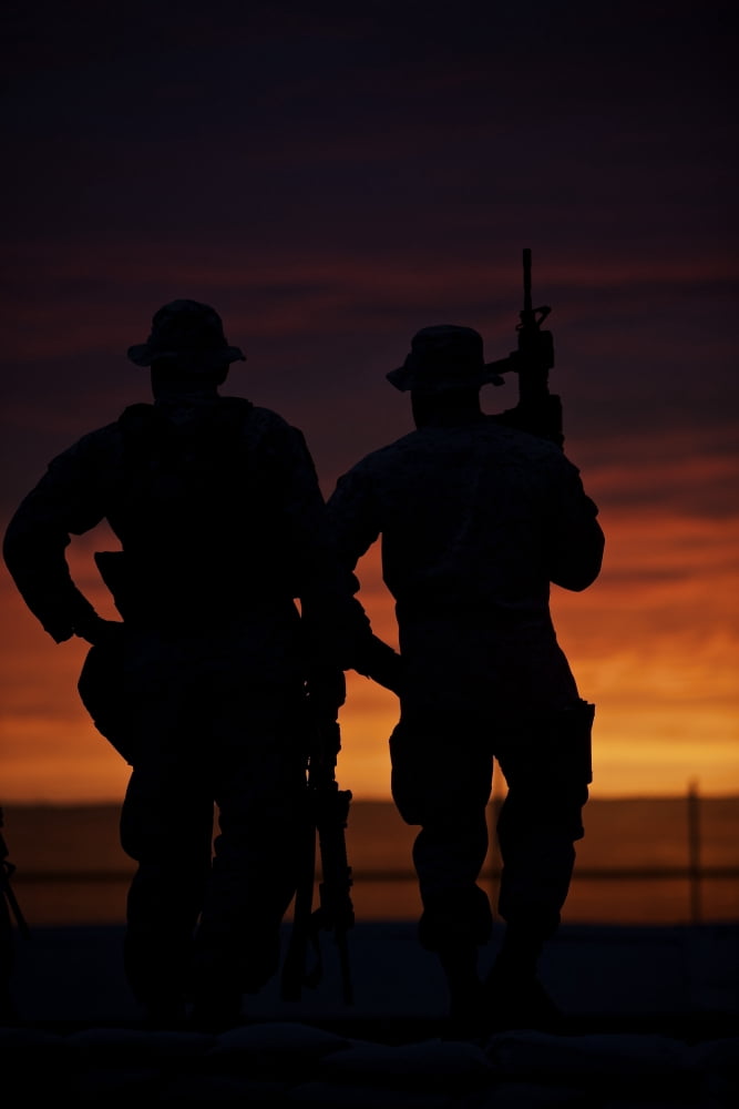 Silhouette of US Marines on a bunker at sunset in Afghanistan Canvas Art - Terry MooreStocktrek Images (12 x 18)