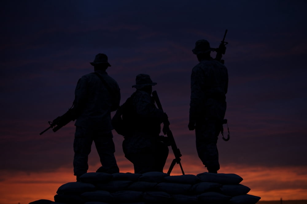 Silhouette of US Marines on a bunker at sunset in Afghanistan Canvas Art - Terry MooreStocktrek Images (35 x 24)