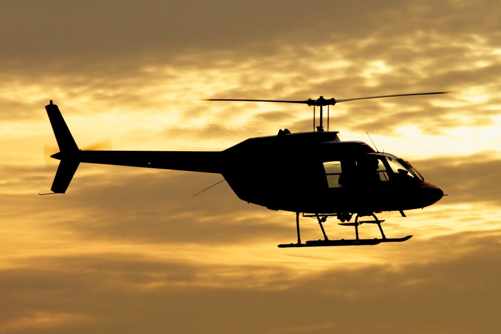 Silhouette of a Bell 206 utility helicopter Canvas Art - Luca NicolottiStocktrek Images (35 x 23)