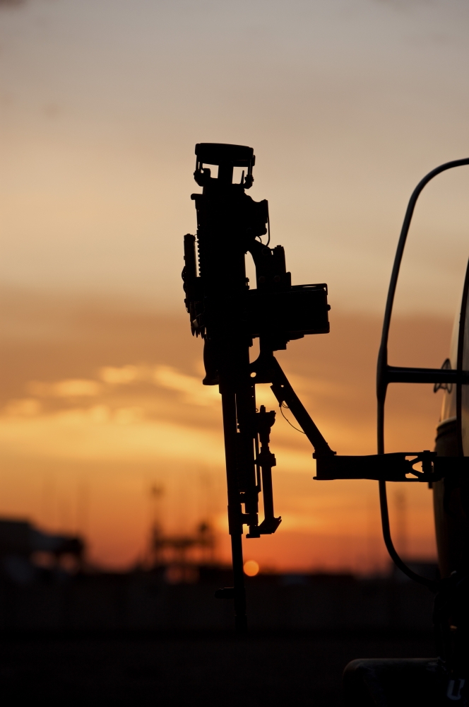 Silhouette of a M240G medium machine gun on a UH-60L Black Hawk Canvas Art - Terry MooreStocktrek Images (23 x 35)