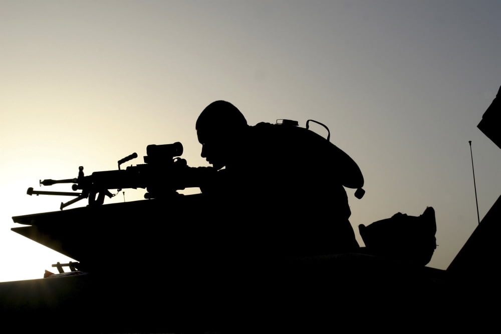 Silhouette of a Squad Automatic Weapon gunner Canvas Art - Stocktrek Images (34 x 23)