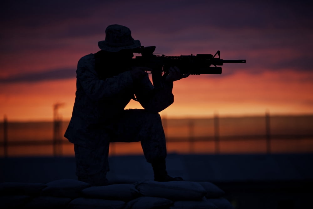 Silhouette of a US Marine on a bunker at sunset in Afghanistan Canvas Art - Terry MooreStocktrek Images (18 x 12)