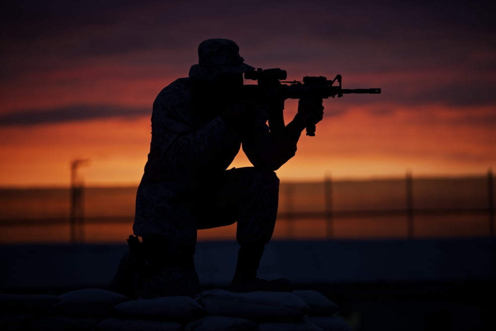 Silhouette of a US Marine on a bunker at sunset in Afghanistan Canvas Art - Terry MooreStocktrek Images (18 x 12)