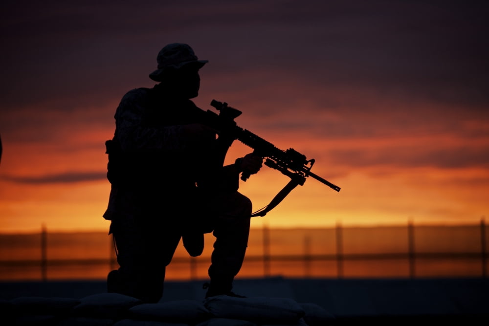 Silhouette of a US Marine on a bunker at sunset in Afghanistan Canvas Art - Terry MooreStocktrek Images (35 x 24)