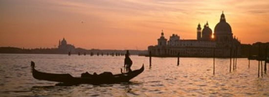Silhouette of a gondola in a canal at sunset Santa Maria Della Salute Venice Italy Canvas Art - Panoramic Images (18 x 7)