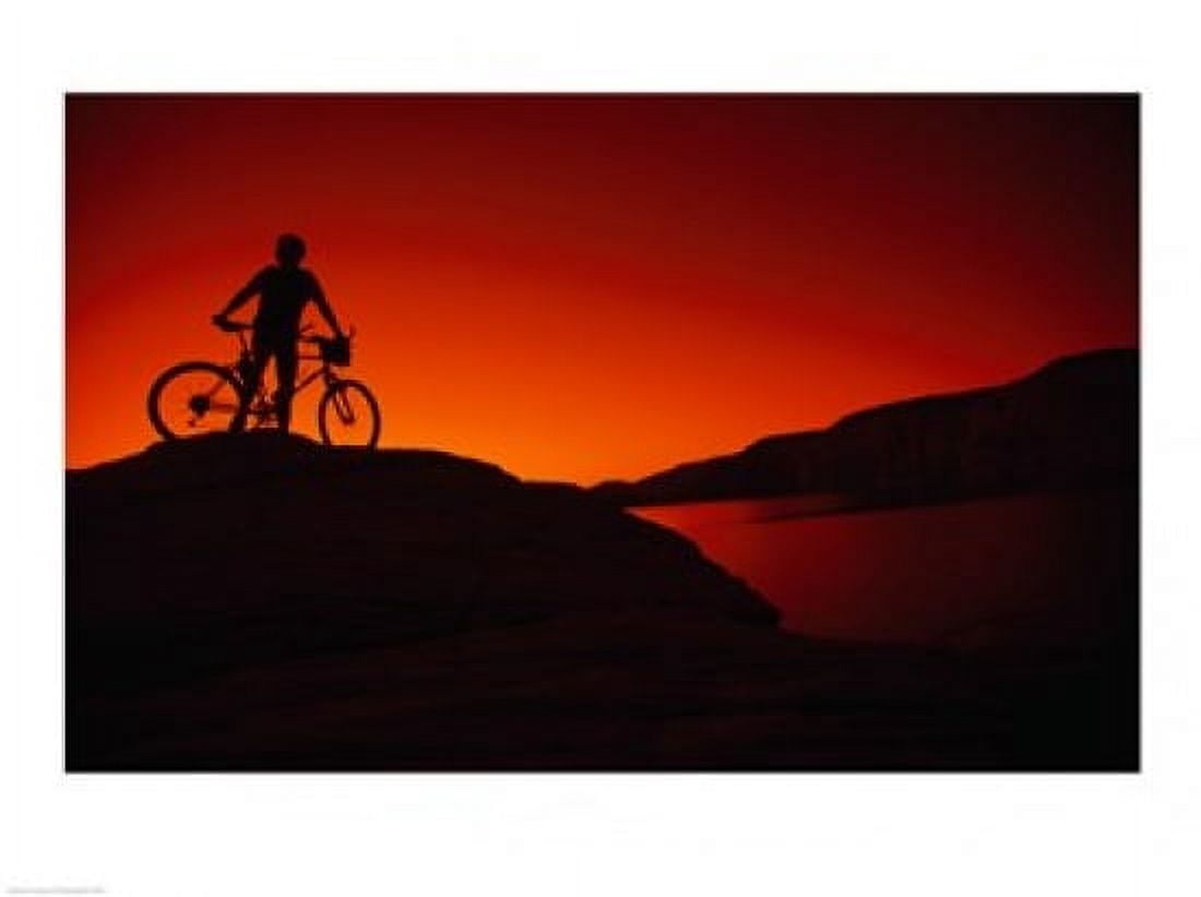 Silhouette of a man standing with his mountain bike Lake Powell Utah USA Canvas Art - (24 x 18)