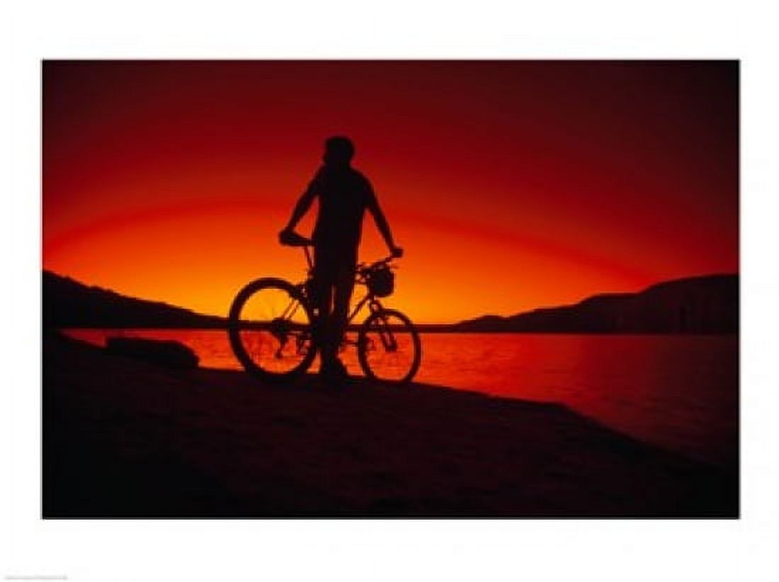 Silhouette of a man standing with his mountain bike Lake Powell Utah USA Canvas Art - (24 x 18)