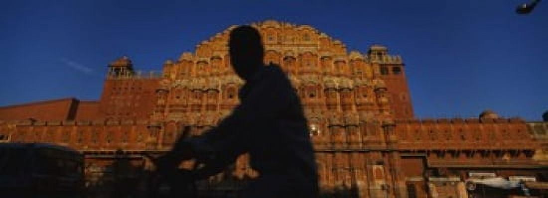 Silhouette of a person riding a motorcycle in front of a palace Hawa Mahal Jaipur Rajasthan India Canvas Art - Panoramic Images (18 x 7)