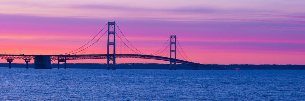 Silhouette of a suspension bridge at sunset Mackinac Bridge Michigan USA Canvas Art - Panoramic Images (36 x 12)