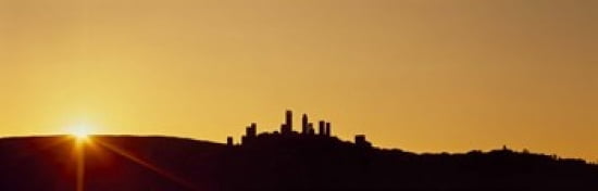 Silhouette of a town on a hill at sunset San Gimignano Tuscany Italy Canvas Art - Panoramic Images (36 x 12)