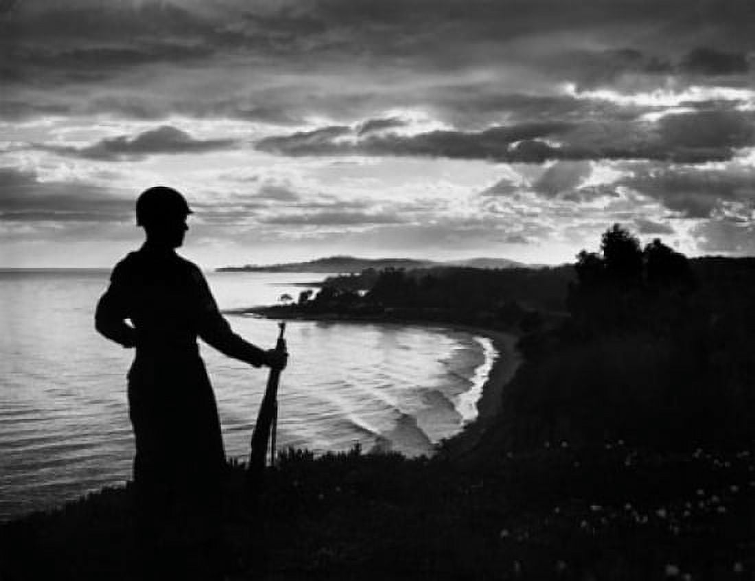 Silhouette of an army soldier standing with gun at dusk Canvas Art - (18 x 24)