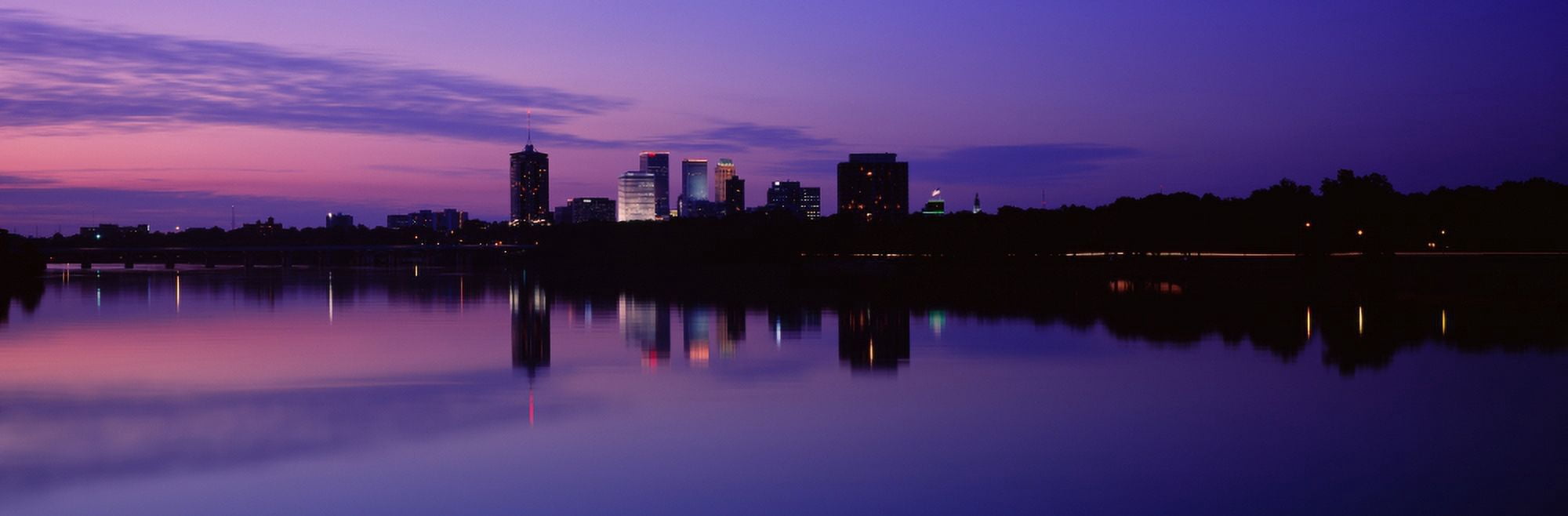 Silhouette of buildings at the waterfront Arkansas River Tulsa Oklahoma USA Canvas Art - Panoramic Images (27 x 9)