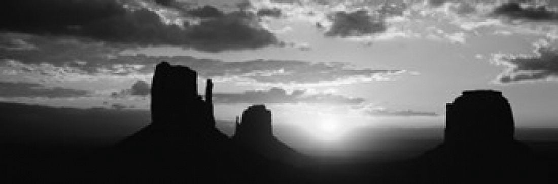 Silhouette of buttes at sunset Monument Valley Utah USA Canvas Art - Panoramic Images (36 x 12)