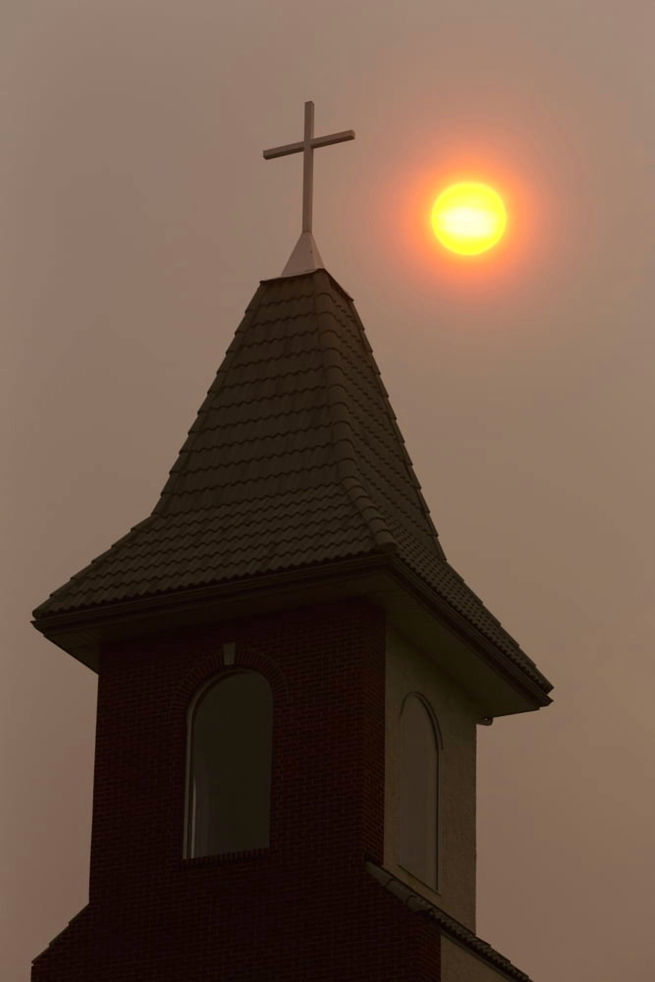 Silhouette of church steeple with orange sun ball in a hazy sky Calgary Alberta Canada Canvas Art - Michael Interisano Design Pics (24 x 38)