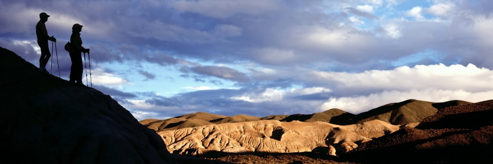Silhouette of hikers standing on a rock Red Rock State Park California USA Canvas Art - Panoramic Images (27 x 9)
