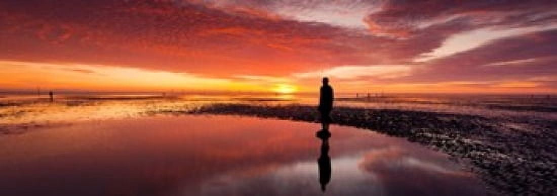 Silhouette of human sculpture on the beach at sunset Another Place Crosby Beach Merseyside England Canvas Art - Panoramic Images (36 x 13)