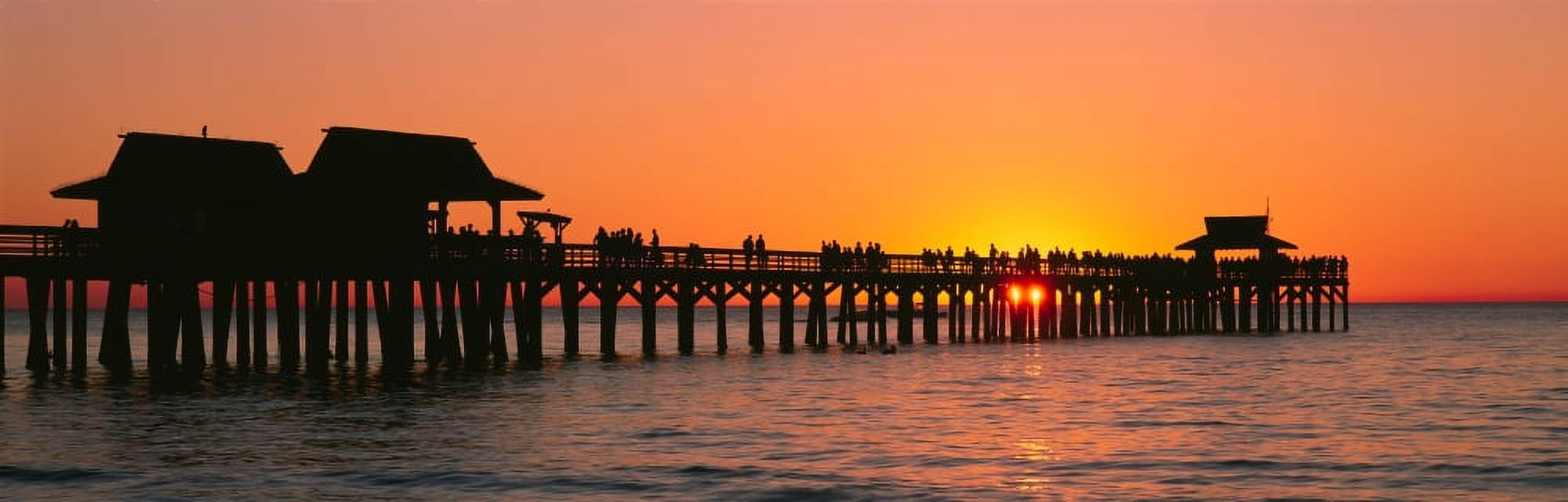 Silhouette of huts and a pier at dusk Naples Pier Gulf of Mexico Florida USA Canvas Art - Panoramic Images (27 x 9)