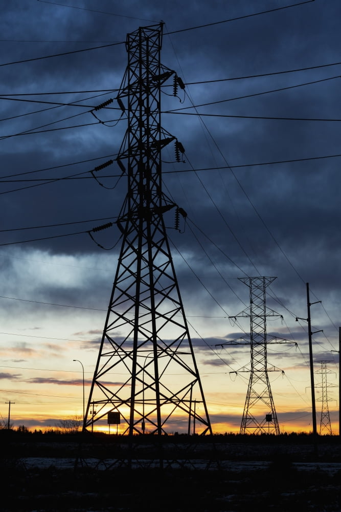 Silhouette of large metal powerline towers with glowing sky Calgary Alberta Canada Canvas Art - Michael Interisano Design Pics (24 x 38)