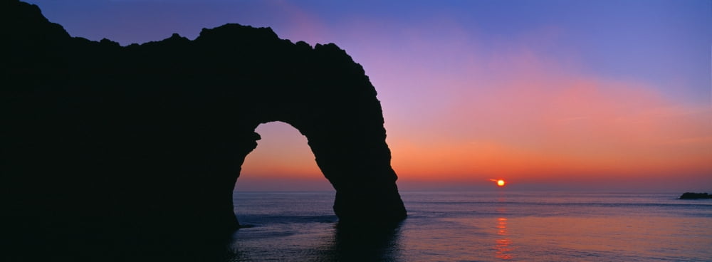 Silhouette of natural arch Durdle Door Dorset England Canvas Art - Panoramic Images (27 x 9)