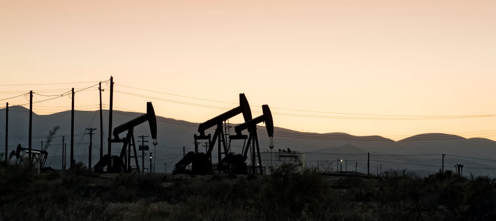 Silhouette of oil rigs at sunset California USA Canvas Art - Panoramic Images (14 x 30)