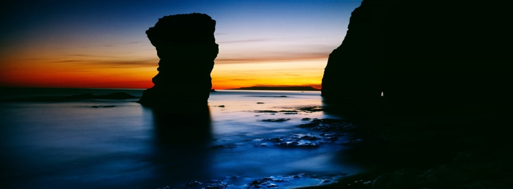 Silhouette of rock formations in the sea Bats Head Dorset England Canvas Art - Panoramic Images (36 x 12)