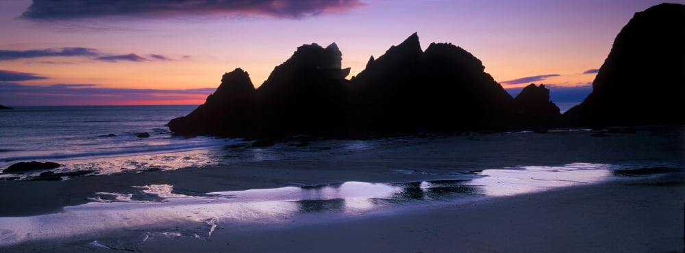 Silhouette of rocks on the beach Erme Mouth River Erme Beacon Point Devon England Canvas Art - Panoramic Images (27 x 9)