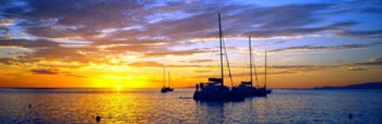 Silhouette of sailboats in the ocean at sunset Tahiti Society Islands French Polynesia Canvas Art - Panoramic Images (36 x 12)