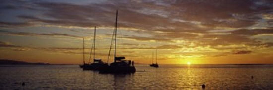 Silhouette of sailboats in the sea at sunset Tahiti French Polynesia Canvas Art - Panoramic Images (18 x 6)