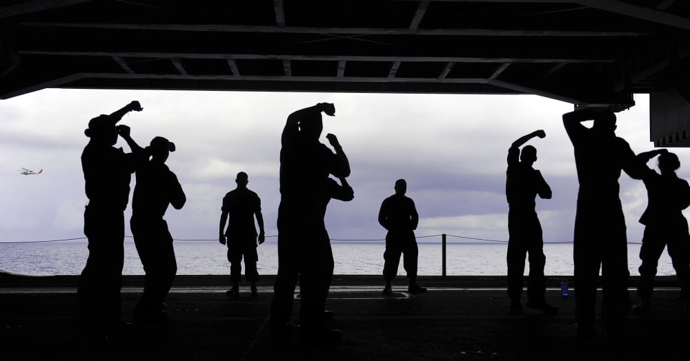 Silhouette of sailors in the hangar bay aboard USS George HW Bush Canvas Art - Stocktrek Images (39 x 21)