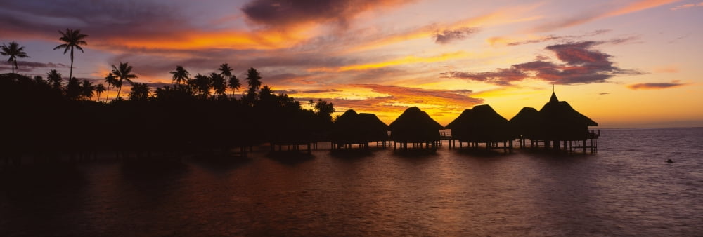 Silhouette of stilt houses on the beach Bora Bora French Polynesia Canvas Art - Panoramic Images (36 x 12)