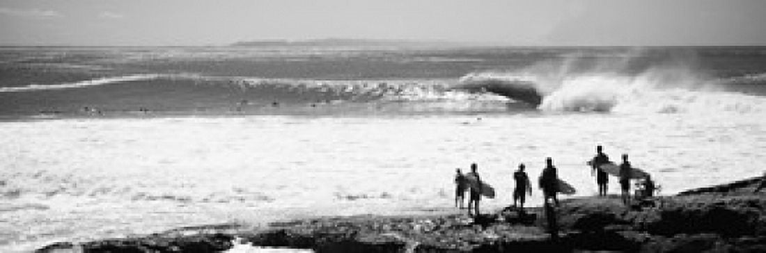 Silhouette of surfers standing on the beach Australia Canvas Art - Panoramic Images (18 x 6)