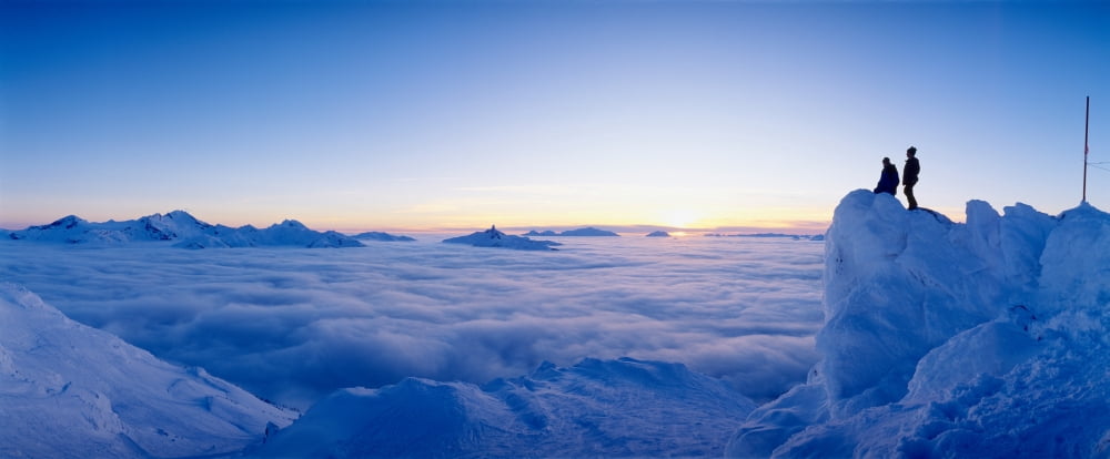 Silhouette of two hikers standing on a mountain peak Whistler British Columbia Canada Canvas Art - Panoramic Images (36 x 12)