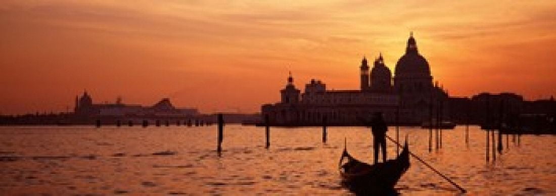 Silhouette of a person on a gondola with a church in background Santa Maria Della Salute Grand Canal Venice Italy Canvas Art - Panoramic Images (18 x 7)