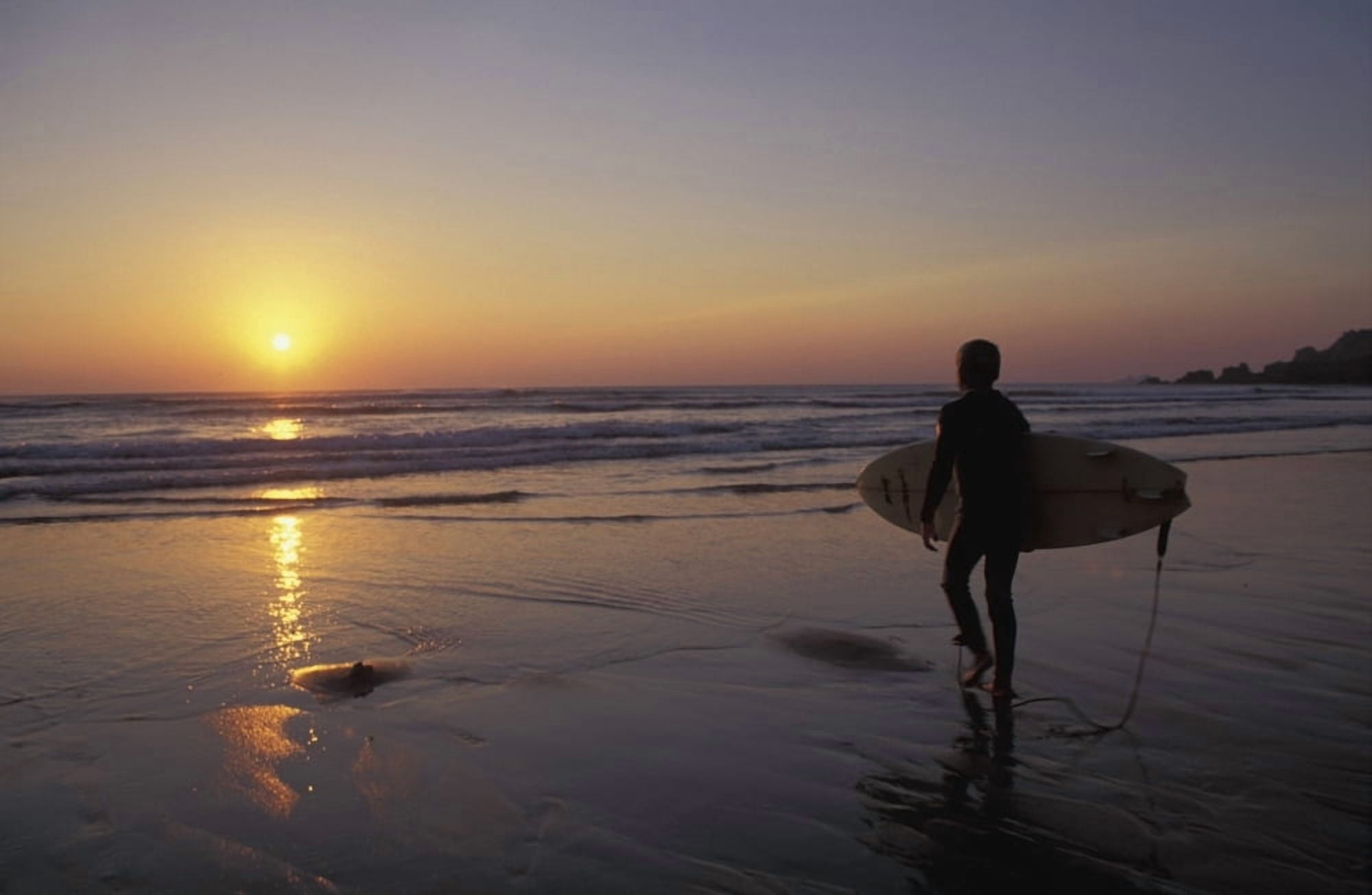 Silhouetted Surfer On Sandy Beach At Sunset Canvas Art - Chris Martin  Design Pics (18 x 11)